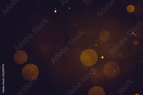 Fototapeta Naklejka Na Ścianę i Meble -  Dark Abstract Gold bokeh sparkle on black background