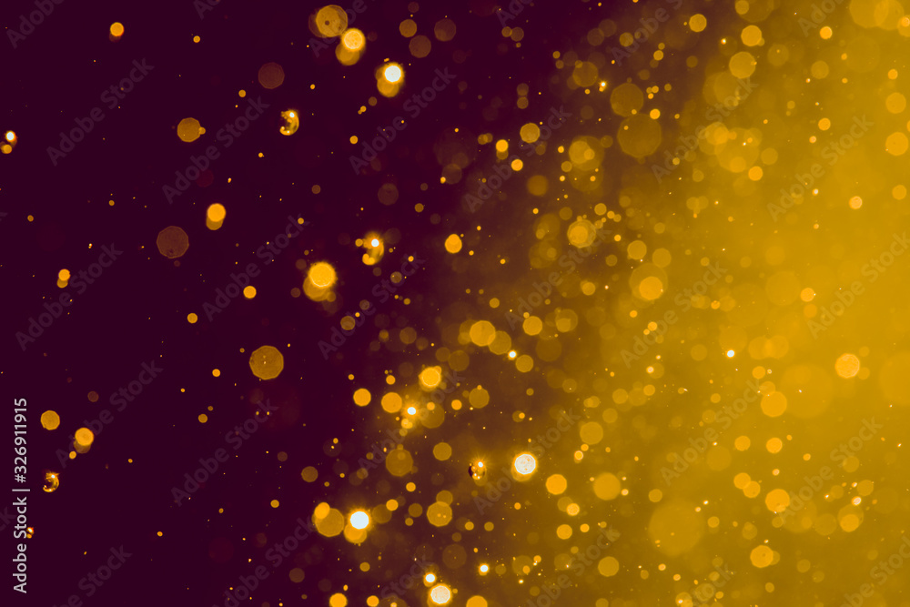 Abstract gold blur glitter bokeh on black