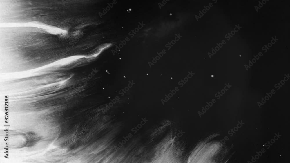 Black ink drops splatters spilling on white background