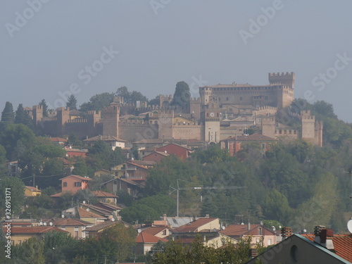 Panorama of Gradara village with walls, towers and the fortress on the hill over the roofs of the houses