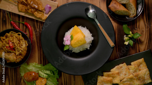 Top view of Thai traditional street food with mango and sticky rice, Thai appetisers
