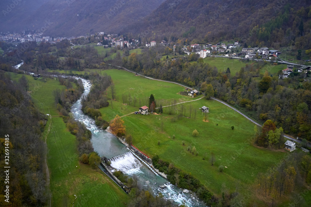 Little Italian village among the Alps in autumn day