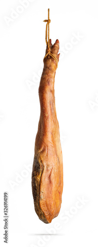 Whole leg of Spanish Iberian serrano ham hanging on a rope. Isolated on a white background