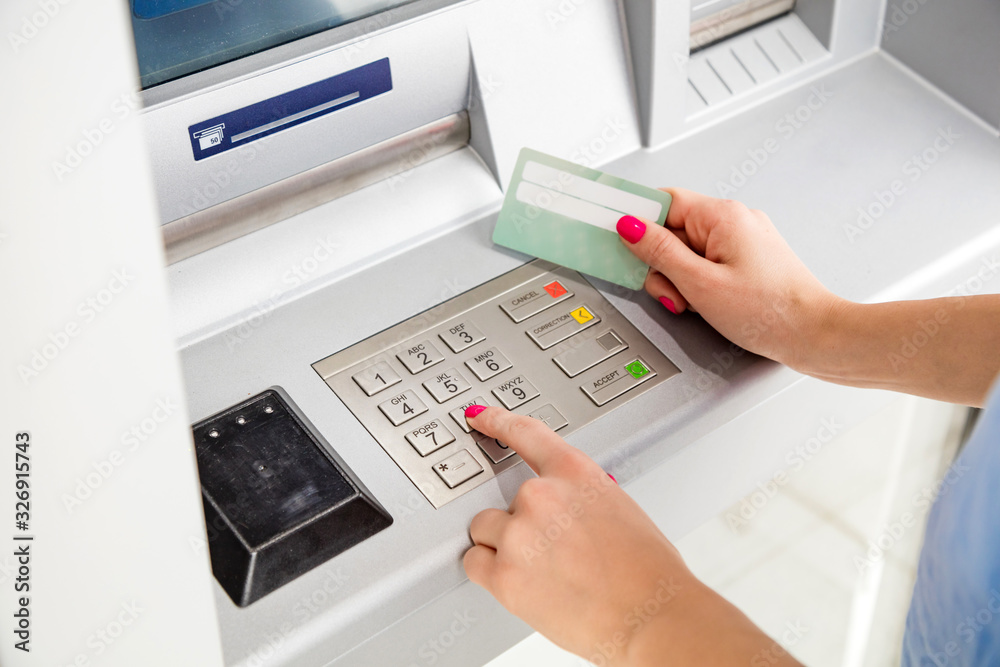 Woman using modern ATM nashine - cash withdrawal. Woman using modern ATM nashine - cash withdrawal.