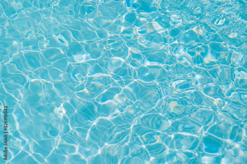 Blue water ripple reflection in the swimming pool