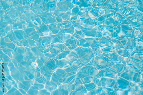 Blue water ripple reflection in the swimming pool