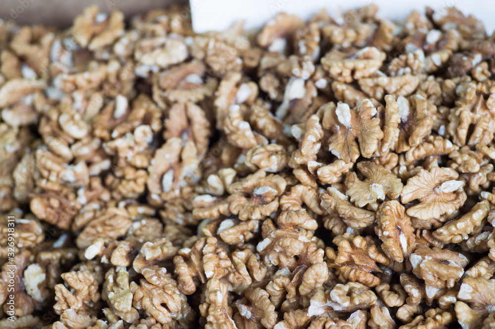 Peeled walnuts. Background. The view from the top at an angle Peeled walnuts. Background. The view from the top at an angle