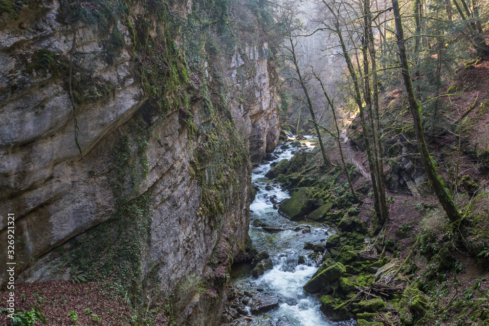 Areuse stream with gorge and hiking trail in Swiss Jura Areuse stream with gorge and hiking trail in Swiss Jura