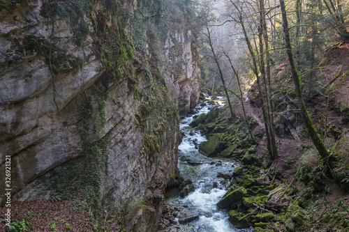 Areuse stream with gorge and hiking trail in Swiss Jura
