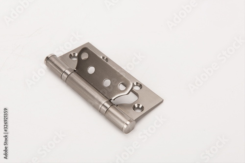 Metal spring butt hinge on a white background