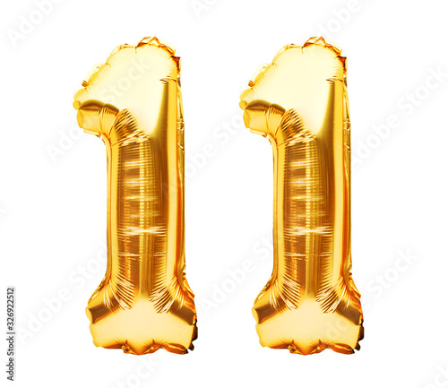 Number 11 eleven made of golden inflatable balloons isolated on white. Helium balloons, gold foil numbers. Party decoration, anniversary sign for holidays, celebration, birthday, carnival