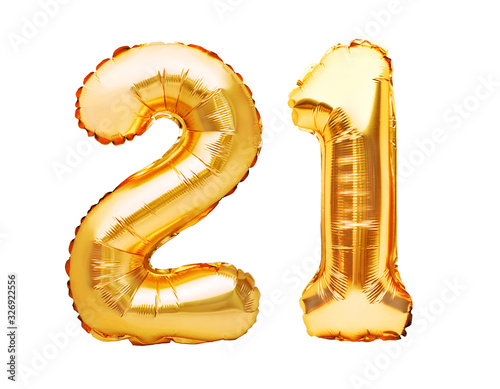 Number 21 twenty one made of golden inflatable balloons isolated on white. Helium balloons, gold foil numbers. Party decoration, anniversary sign for holidays, celebration, birthday, carnival