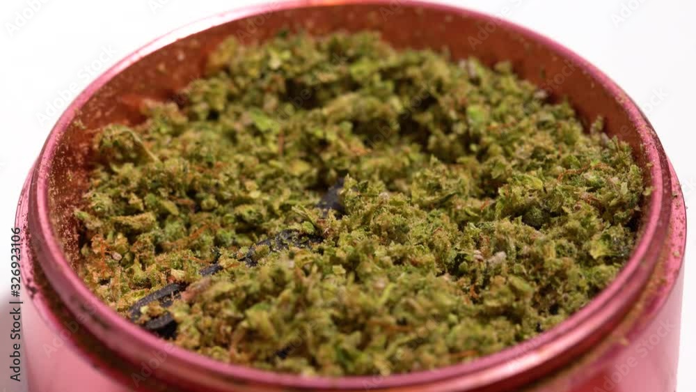Ground up marijuana in grinder Ground up marijuana in grinder
