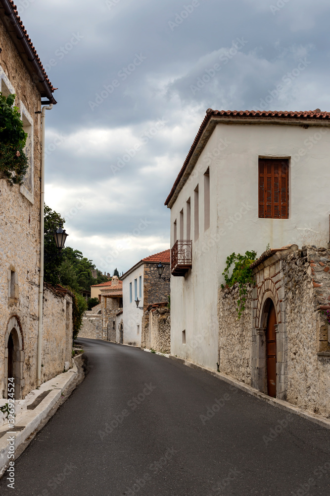 Street with stone houses in the village close-up