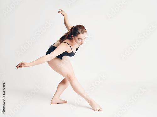 brunette girl shows different elements of ballet on a white background