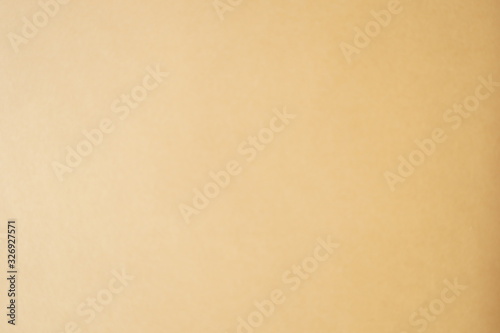 natural background sand yellow brawn warm modern color on a sheet of paper the texture of cardboard