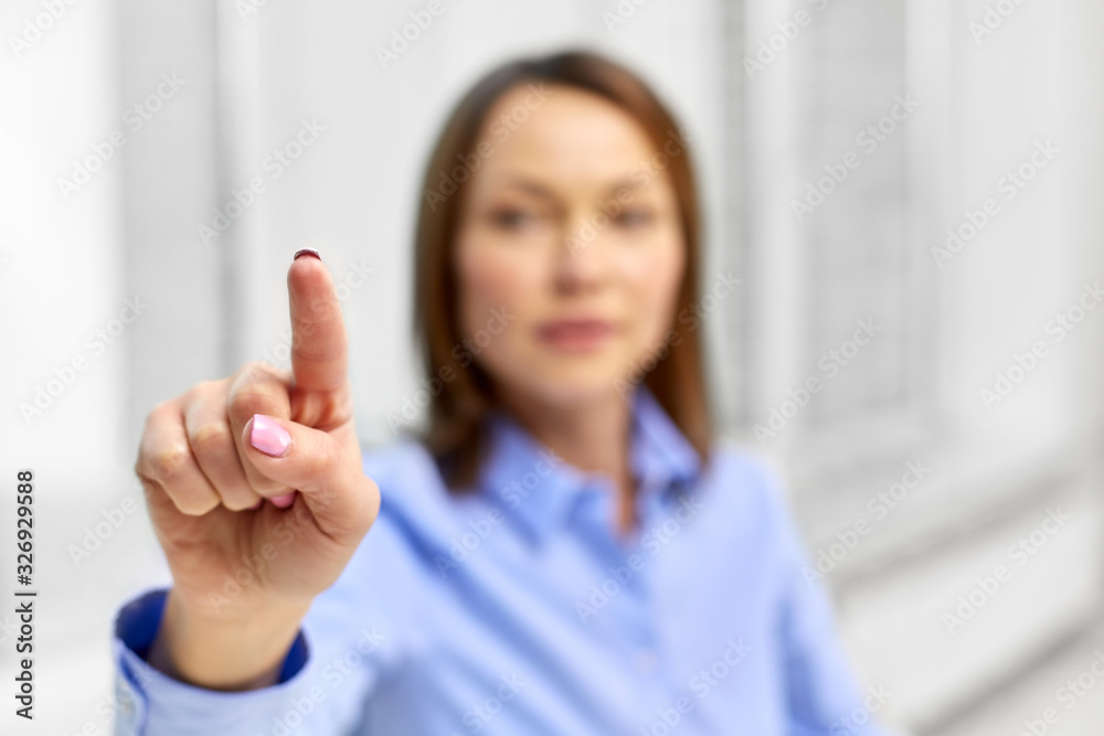 business and people concept - close up of businesswoman touching something with finger