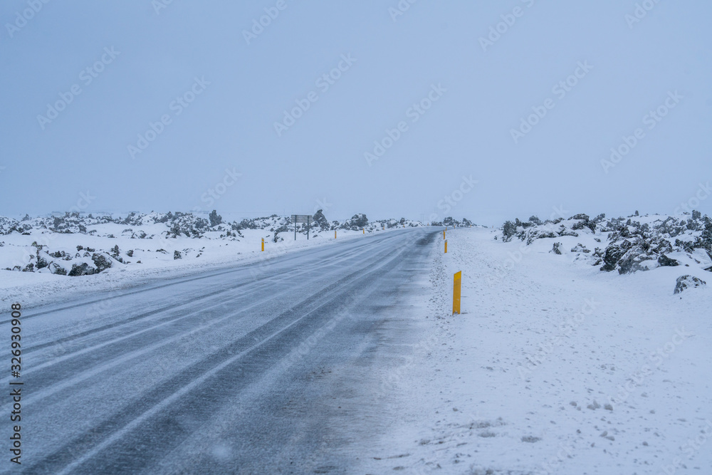 Rural curve highway road among the snow mountain in Iceland Rural curve highway road among the snow mountain in Iceland