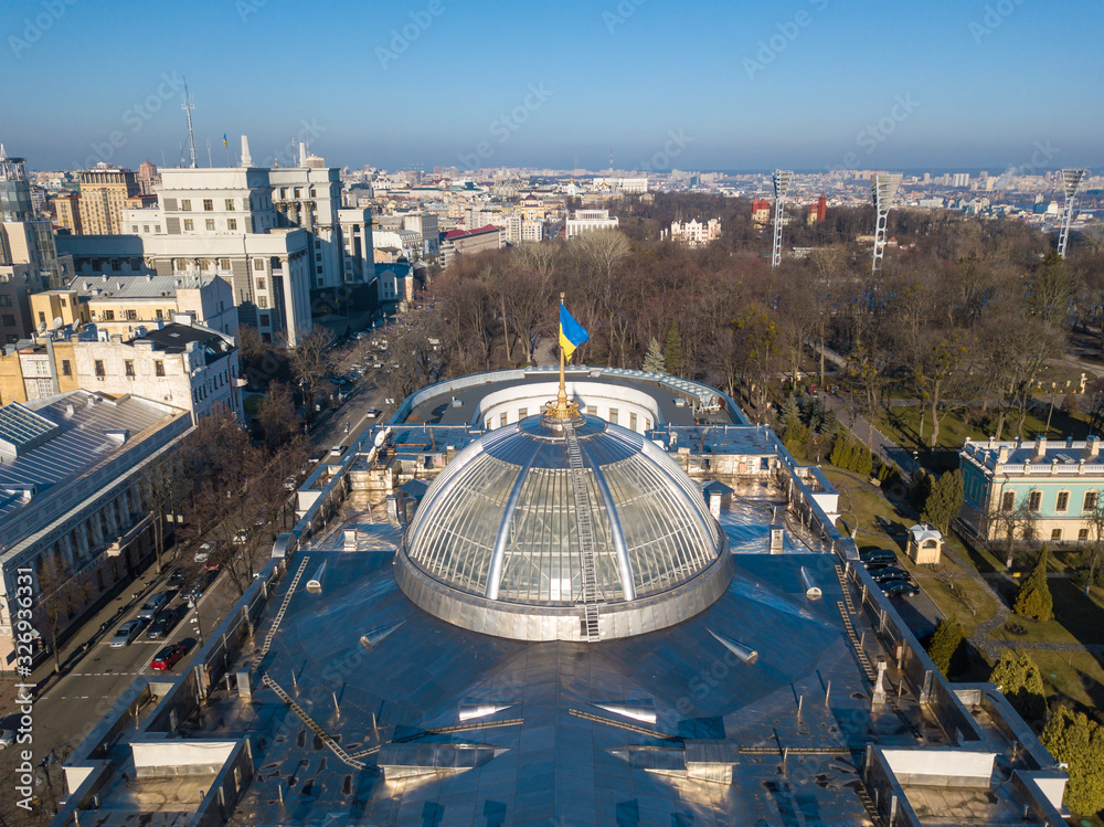 Aerial drone view. Dome of the building Verkhovna Rada of Ukraine with flag.