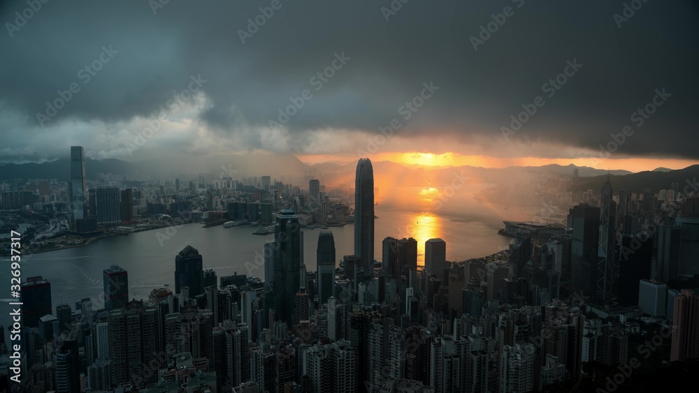 Sunset cityscape. Panorama of Hong Kong city and river landscape during dusk. China