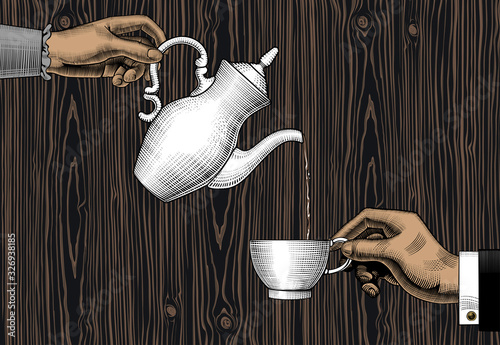 Hands with a coffee cup and a coffee pot.