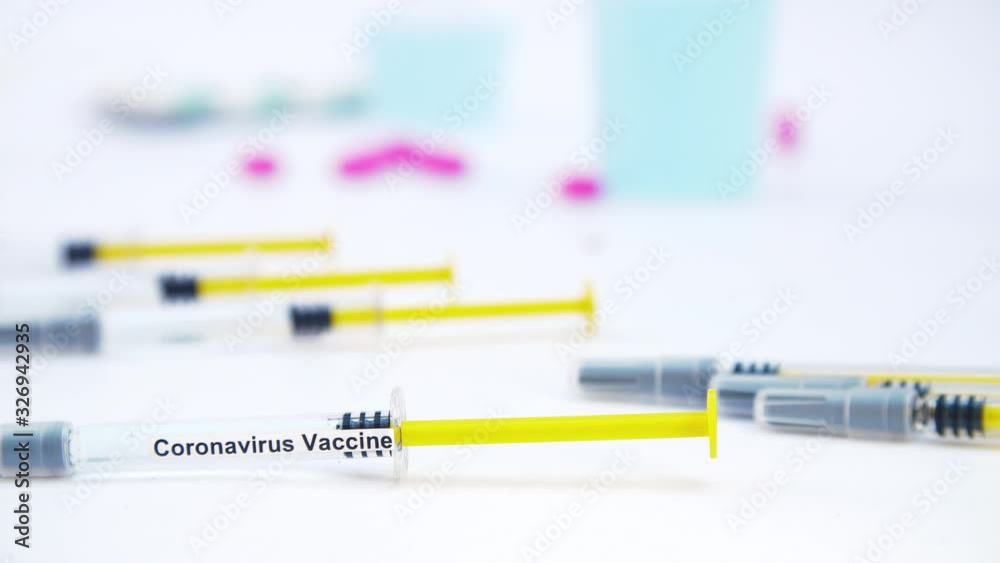 Coronavirus vaccine ready to be applied. Raw of syringes and medicines. Tracking Shot Coronavirus vaccine ready to be applied. Raw of syringes and medicines. Tracking Shot