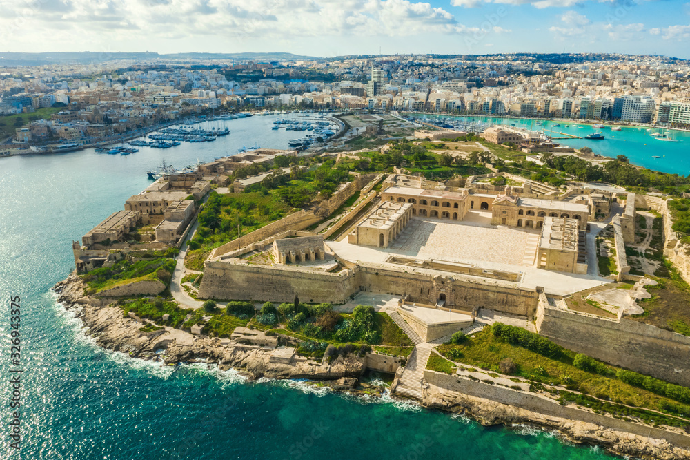 Aerial panorama view of Fort Manoel on Manoel island, Gzira city. Blue sky and clouds. Malta island