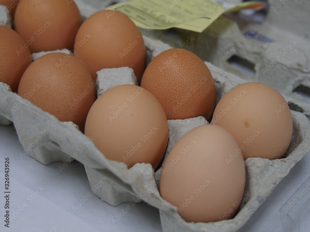 Paper tray of native brown eggs produced in a local farm Paper tray of native brown eggs produced in a local farm