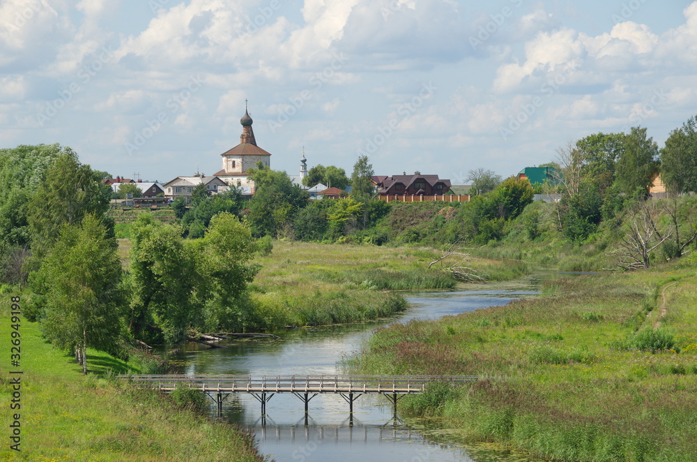 Kamenka river and the Church of Cosma and Damian in Korovniki in Suzdal. Golden ring of Russia Kamenka river and the Church of Cosma and Damian in Korovniki in Suzdal. Golden ring of Russia