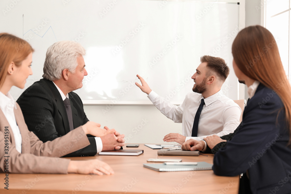 Professional business trainer working with people in office Professional business trainer working with people in office