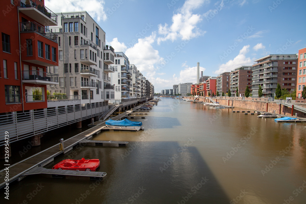 West haven in Frankfurt Germany on the River Main with apartment houses, sprot boats and blue skies