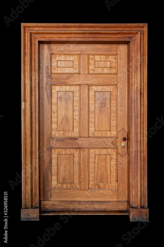 Antique wooden door on a black background.