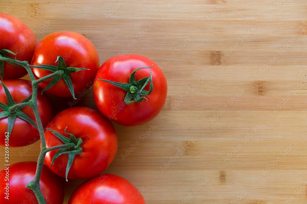 Tomatoes on top of a wood Tomatoes on top of a wood