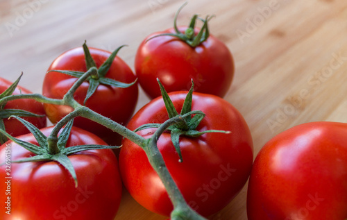 Tomatoes on top of a wood