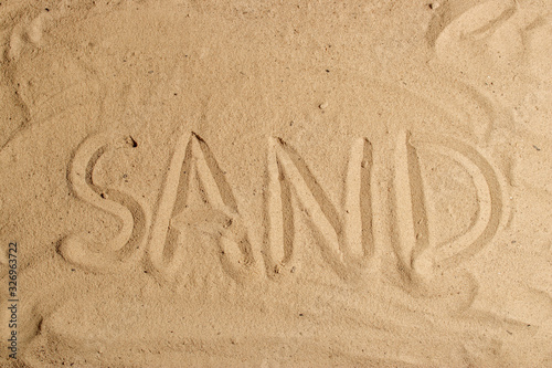 Inscription on the sand letter word