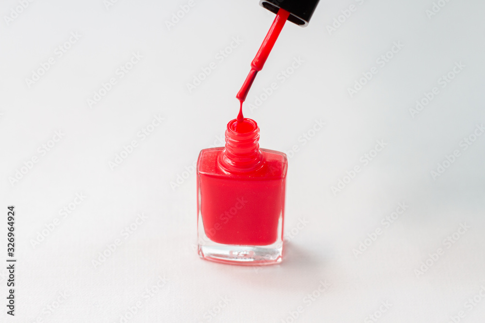 nail polish drop over bottle on white background nail polish drop over bottle on white background