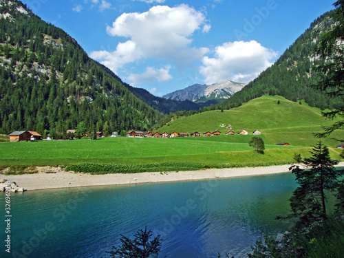 Artifical lake Gänglesee (Ganglesee or Gaenglesee) on the Valünerbach (Valunerbach or Valuenerbach) stream and in the Saminatal alpine valley - Steg, Liechtenstein photo