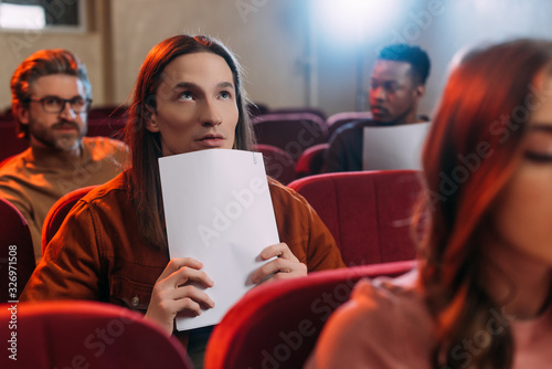multiethnic actors and actress reading scripts in theatre