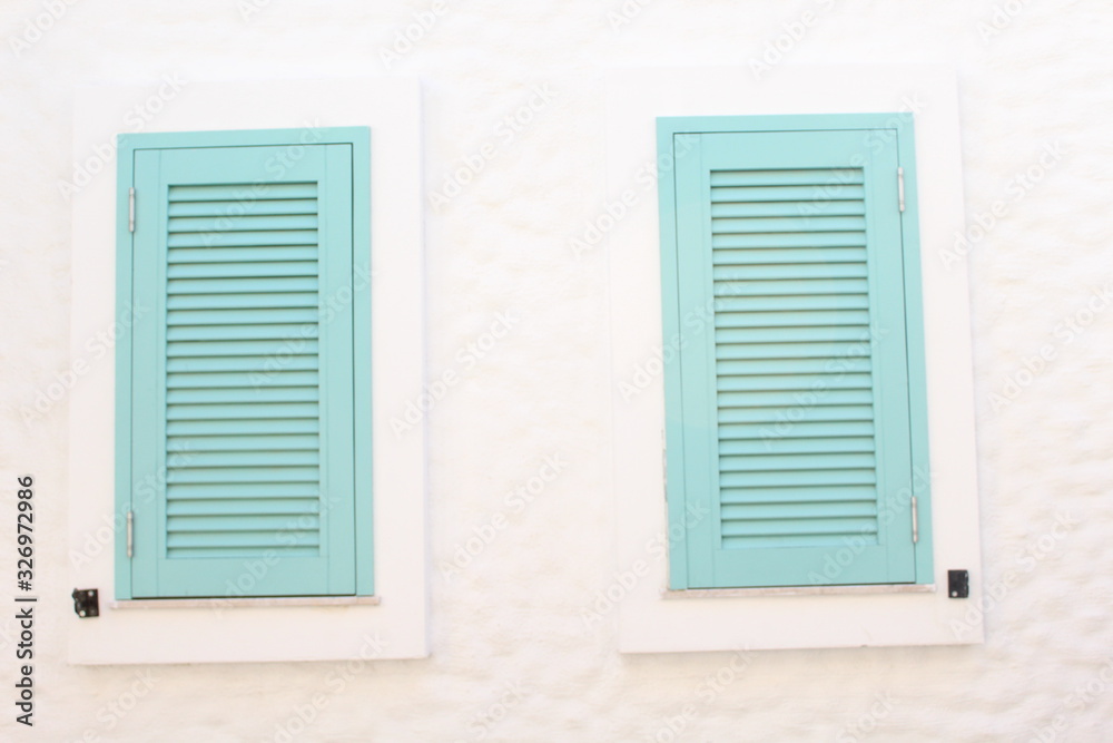 window with blue shutters