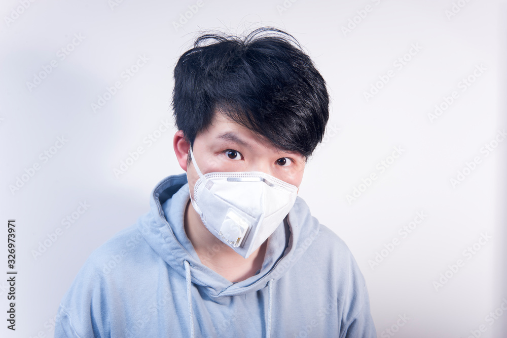 A man wearing a N95 medical protective mask A man wearing a N95 medical protective mask
