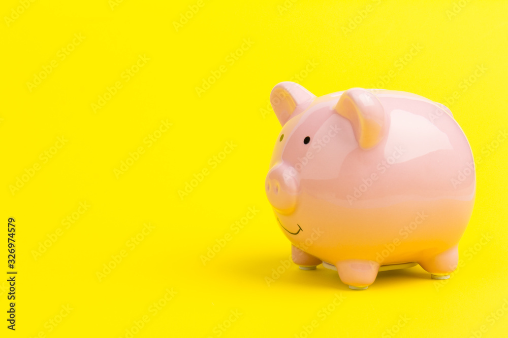 Pink piggy bank on color background. Money saving