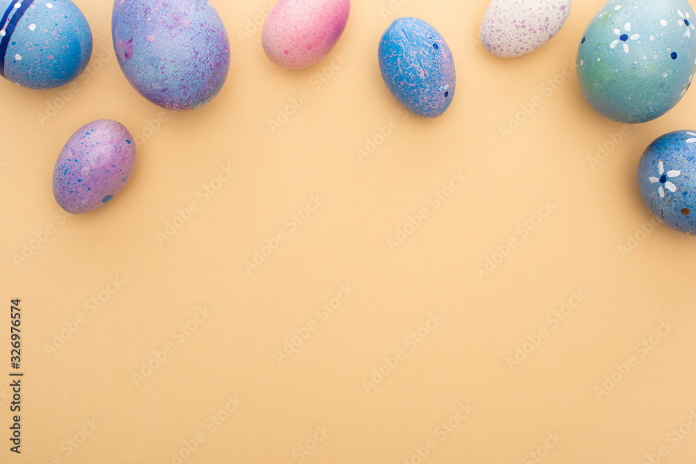 Top view of purple chicken eggs on beige background Top view of purple chicken eggs on beige background