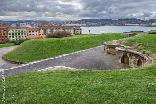 Aerial view with historic fortification on Santa Catalina headland in Gijon city in Spain photo