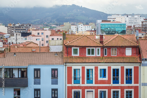 Houses in Cimavilla district of Gijon city in Spain - aerial view from Santa Catalina headland photo