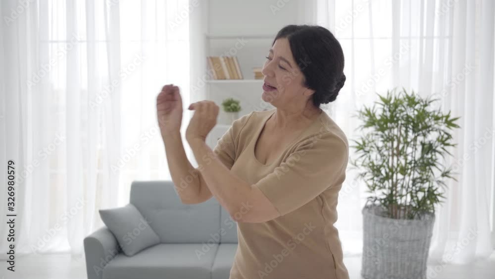 Portrait of senior Caucasian theater actress practicing role at home. Elegant middle-aged woman looking aside and talking emotionally. Hobby, profession, lifestyle. Portrait of senior Caucasian theater actress practicing role at home. Elegant middle-aged woman looking aside and talking emotionally. Hobby, profession, lifestyle.