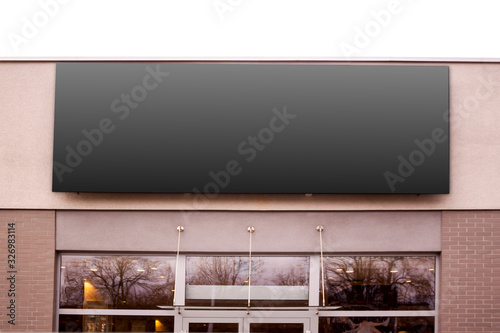 Mockup of the black blank rectangle hanging logo sign in frame on the building wall or facade