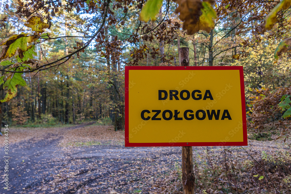 Fototapeta premium sign saying Tank Road near military ground close to the Sulejowek town in Masovia region of Poland