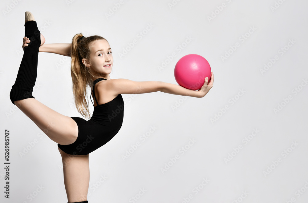 girl gymnast trains with a gymnastic ball . children's professional sports. rhythmic  gymnastics. Stock Photo | Adobe Stock