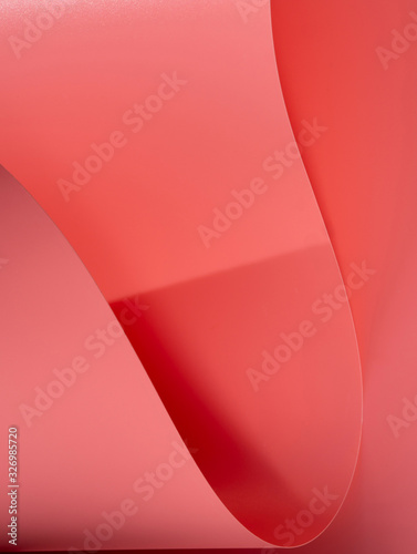 Extreme close-up of pink curved sheets of paper