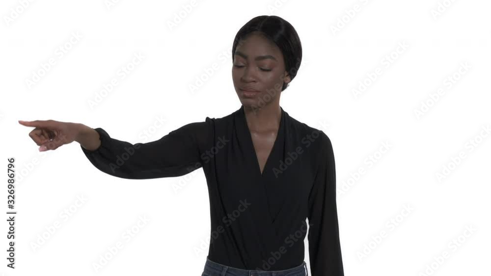 Close-up portrait of a confident young woman pointing with index finger to the camera. Choice sign, confident gesture. Isolated, on white background Close-up portrait of a confident young woman pointing with index finger to the camera. Choice sign, confident gesture. Isolated, on white background
